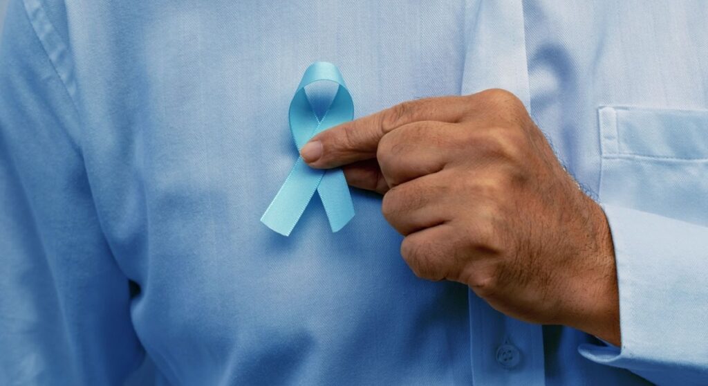 blue november man holding blue ribbon 1