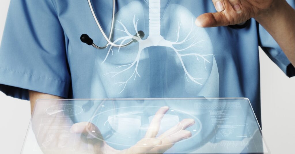 doctors using transparent tablet with hologram medical technology